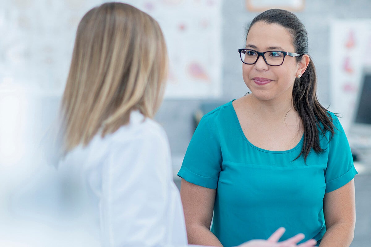 Woman talking with gynecologist